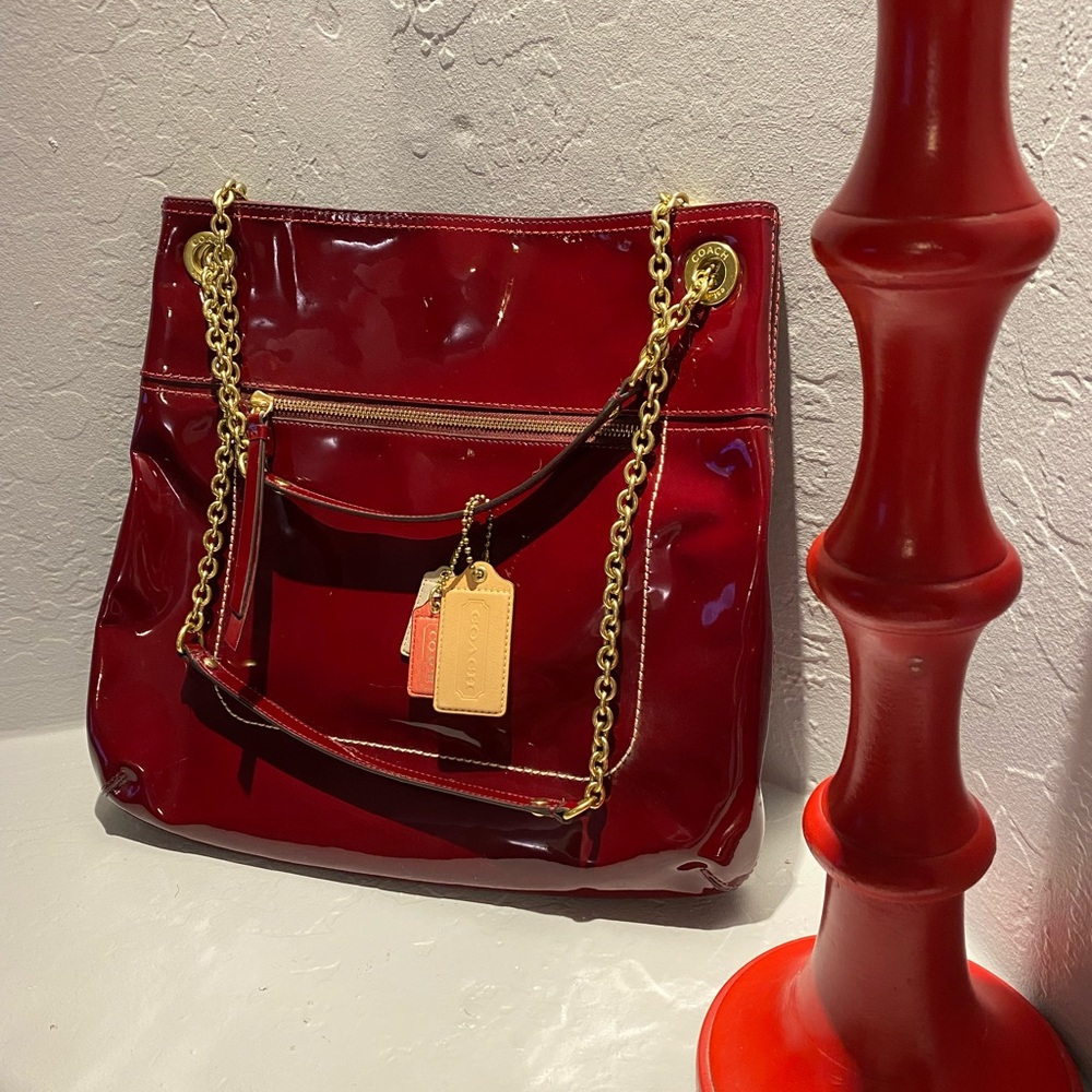 Cherry red Patent Leather Coach Bag with chain straps.